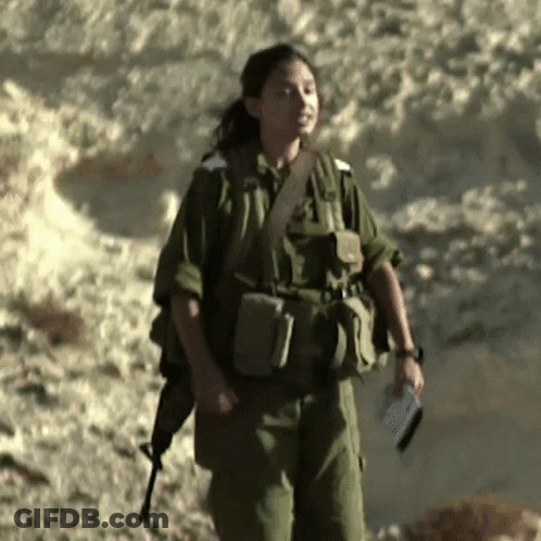 Woman In Military Uniform Holding Book And Gun GIF
