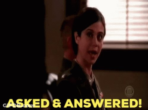 A Woman In A Military Uniform Is Standing In Front Of A Window And Says Asked And Answered GIF