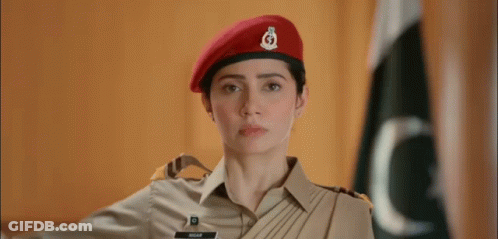 A Woman In A Military Uniform Is Wearing A Red Beret And Saluting . GIF