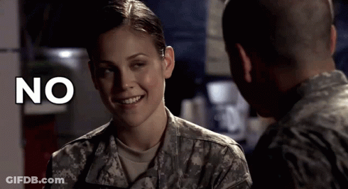 Woman In Military Uniform Smiling At Man With No Above Her GIF