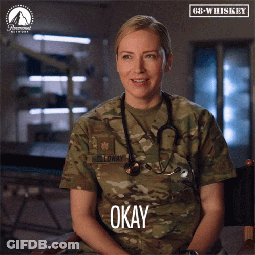 A Woman In A Military Uniform With Holloway Written On Her Uniform GIF