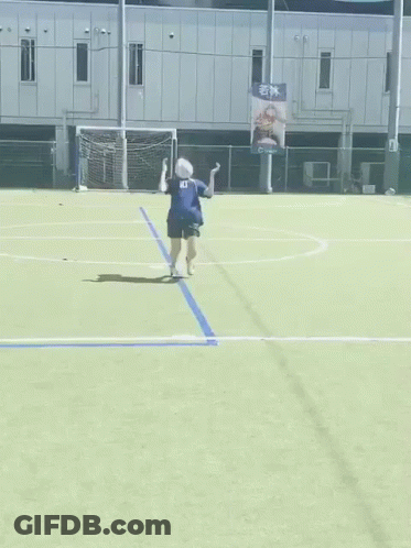 A Woman In A Number 10 Jersey Is Kicking A Soccer Ball GIF