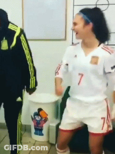 A Woman In A Number 7 Jersey Is Dancing GIF