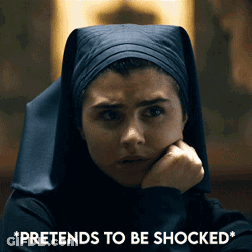 A Woman In A Nun 'S Outfit Is Pretending To Be Shocked With Her Hand On Her Chin GIF