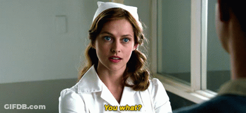 A Woman In A Nurse 'S Uniform Is Talking To A Man And Says " You What " GIF