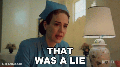 A Woman In A Nurse 'S Uniform Says That Was A Lie In Front Of A Lamp . GIF