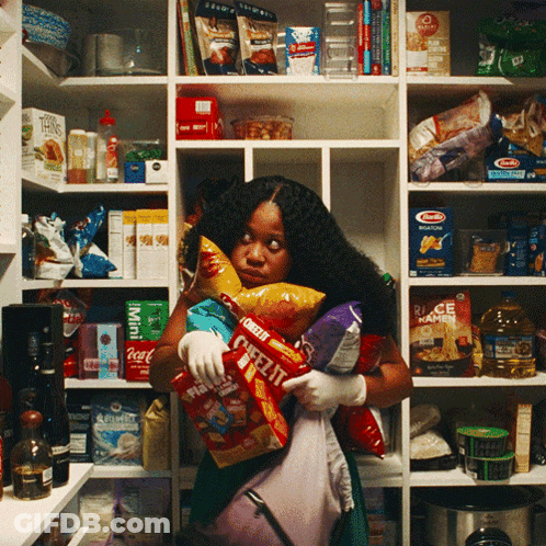 A Woman In A Pantry Holds A Bag Of Ritz Crackers GIF