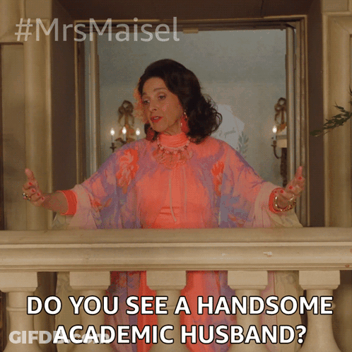 A Woman In A Pink And Purple Dress Is Standing On A Balcony And Asking Do You See A Handsome Academic Husband GIF