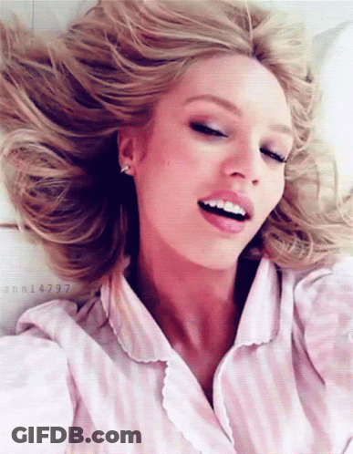 A Woman In A Pink And White Striped Shirt Has The Number Ann14797 On The Bottom GIF