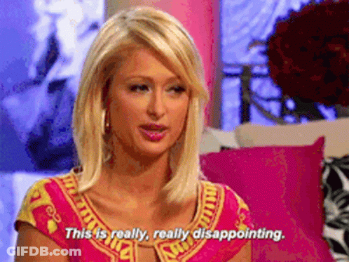 A Woman In A Pink And Yellow Top Says This Is Really Disappointing GIF
