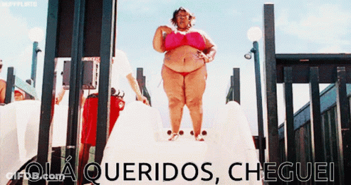 A Woman In A Pink Bikini Is Standing On A Slide With The Words Ola Queridos Cheguei Written On The Bottom GIF