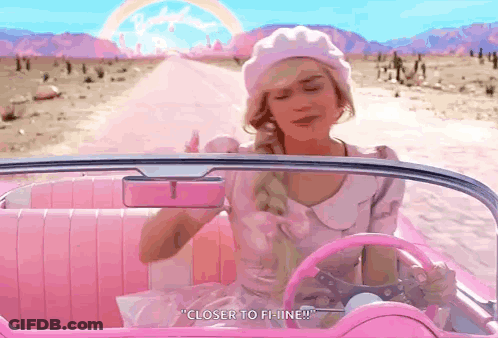 A Woman In A Pink Car Says " Closer To F-Line " GIF