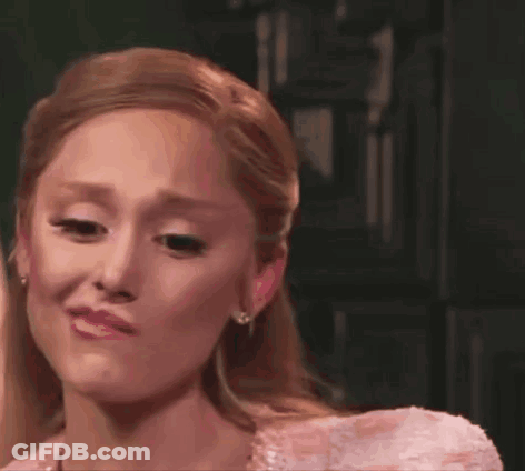 A Woman In A Pink Dress Is Crying . GIF