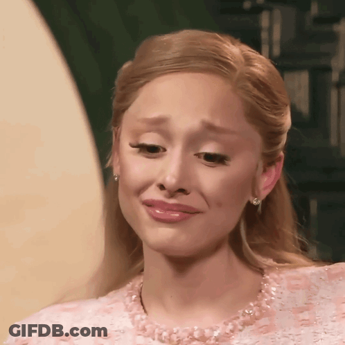 A Woman In A Pink Dress Is Crying GIF
