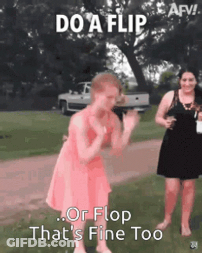 A Woman In A Pink Dress Is Dancing In A Field With A Truck In The Background . GIF