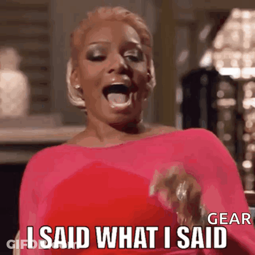 A Woman In A Pink Dress Is Laughing And Saying I Said What I Said . GIF