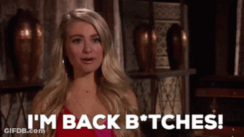 A Woman In A Pink Dress Is Saying I 'M Back Bitches GIF