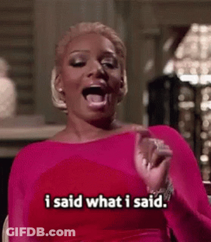 A Woman In A Pink Dress Is Saying I Said What I Said . GIF