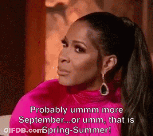 A Woman In A Pink Dress Is Saying `` Probably Ummm More September ... Or Umm , That Is Spring - Summer ! '' GIF