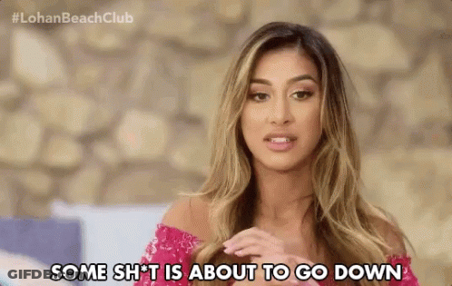 A Woman In A Pink Dress Is Saying Some Shit Is About To Go Down . GIF