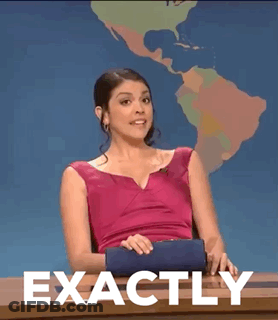A Woman In A Pink Dress Is Sitting At A Desk With The Words Exactly Written On It . GIF