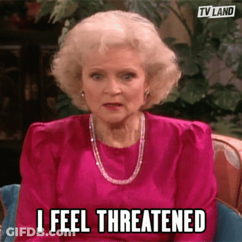 Woman In Pink Dress Says I Feel Threatened GIF