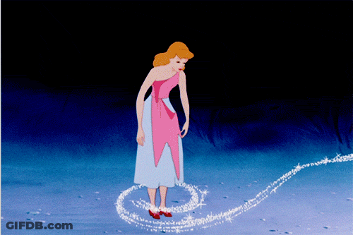 A Woman In A Pink Dress Is Standing In A Circle Of Glitter GIF