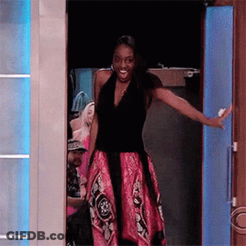 Woman In Pink Dress With Outstretched Arms GIF