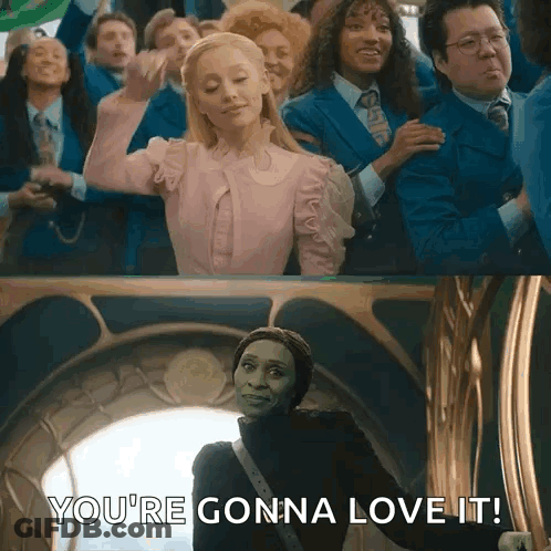 A Woman In A Pink Dress Is Standing In Front Of A Group Of People And Says `` You 'Re Gonna Love It '' . GIF