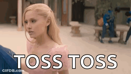 A Woman In A Pink Dress Is Standing Next To A Man In A Blue Shirt And Says `` Toss Toss '' . GIF