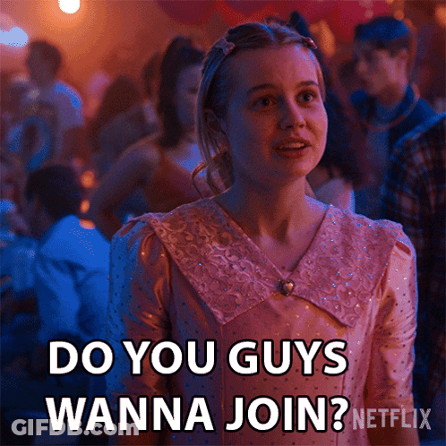 A Woman In A Pink Dress Says Do You Guys Wanna Join Netflix GIF
