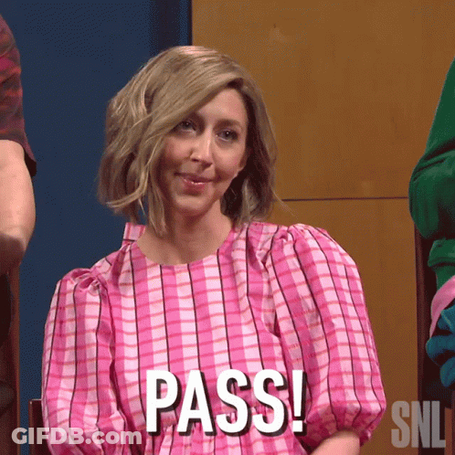 A Woman In A Pink Dress Says Pass On Her Shirt GIF