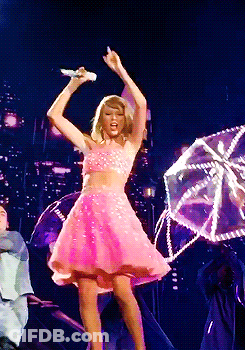 Woman In Pink Dress Singing On Stage GIF