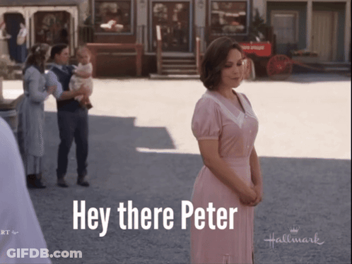 A Woman In A Pink Dress Stands In Front Of A Sign That Says " Hey There Peter " GIF
