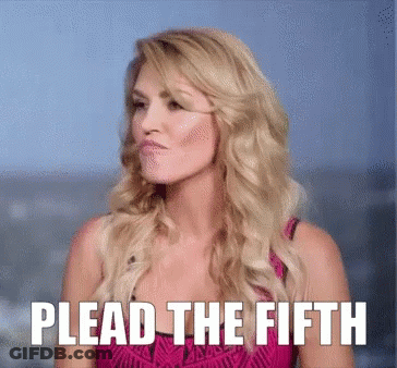 A Woman In A Pink Dress With Plead The Fifth Written Above Her GIF