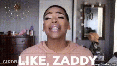 A Woman In A Pink Hoodie Is Making A Face And Saying Like Zaddy . GIF