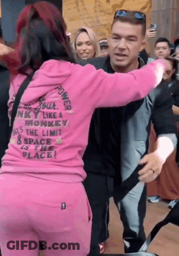 A Woman In A Pink Hoodie That Says Power On It GIF