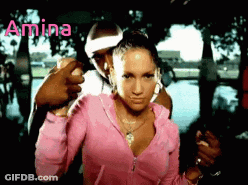 A Woman In A Pink Jacket Is Standing Next To A Man With The Word Amina Written On The Bottom GIF