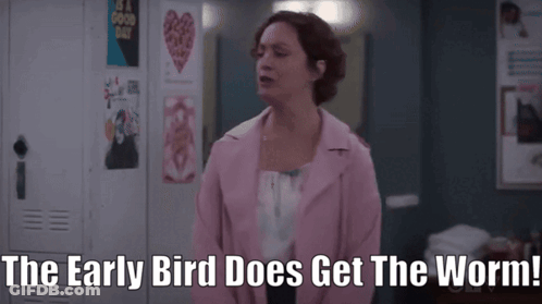 A Woman In A Pink Jacket Says " The Early Bird Does Get The Worm! " GIF