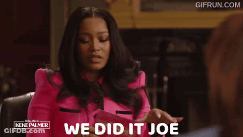 A Woman In A Pink Jacket With The Words We Did It Joe GIF