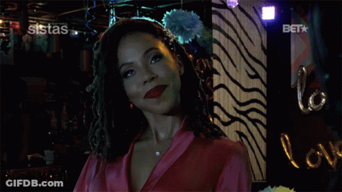A Woman In A Pink Robe Says I Did In Front Of A Zebra Print Wall GIF
