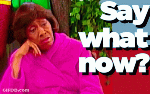 A Woman In A Pink Robe With The Words Say What Now Below Her GIF