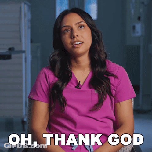 A Woman In A Pink Scrub Is Sitting In A Chair And Says Oh Thank God GIF