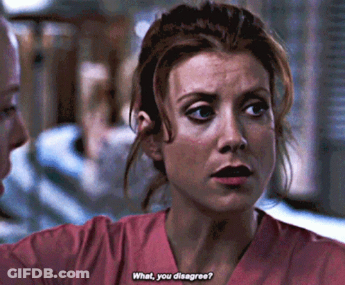 Woman In Pink Scrubs Talking To Man GIF