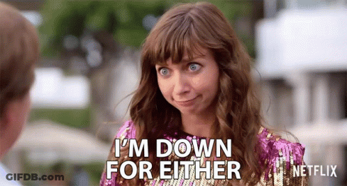 A Woman In A Pink Sequined Dress Is Saying I 'M Down For Either . GIF
