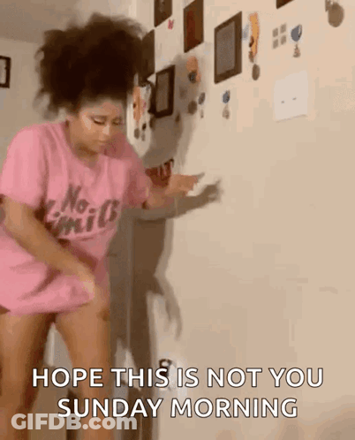 A Woman In A Pink Shirt Is Dancing In Front Of A Wall And Says Hope This Is Not You Sunday Morning GIF