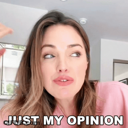 A Woman In A Pink Shirt Is Making A Face And Says Just My Opinion GIF
