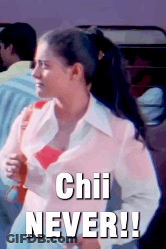 A Woman In A Pink Shirt Is Standing In Front Of A Sign That Says " Chili Never " GIF