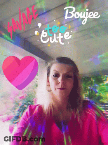 A Woman In A Pink Shirt Is Surrounded By A Heart And The Words " Savage Too Cute " GIF