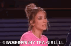 A Woman In A Pink Shirt Is Talking Into A Microphone And Saying `` Where 'S My Tea Girl ? '' GIF